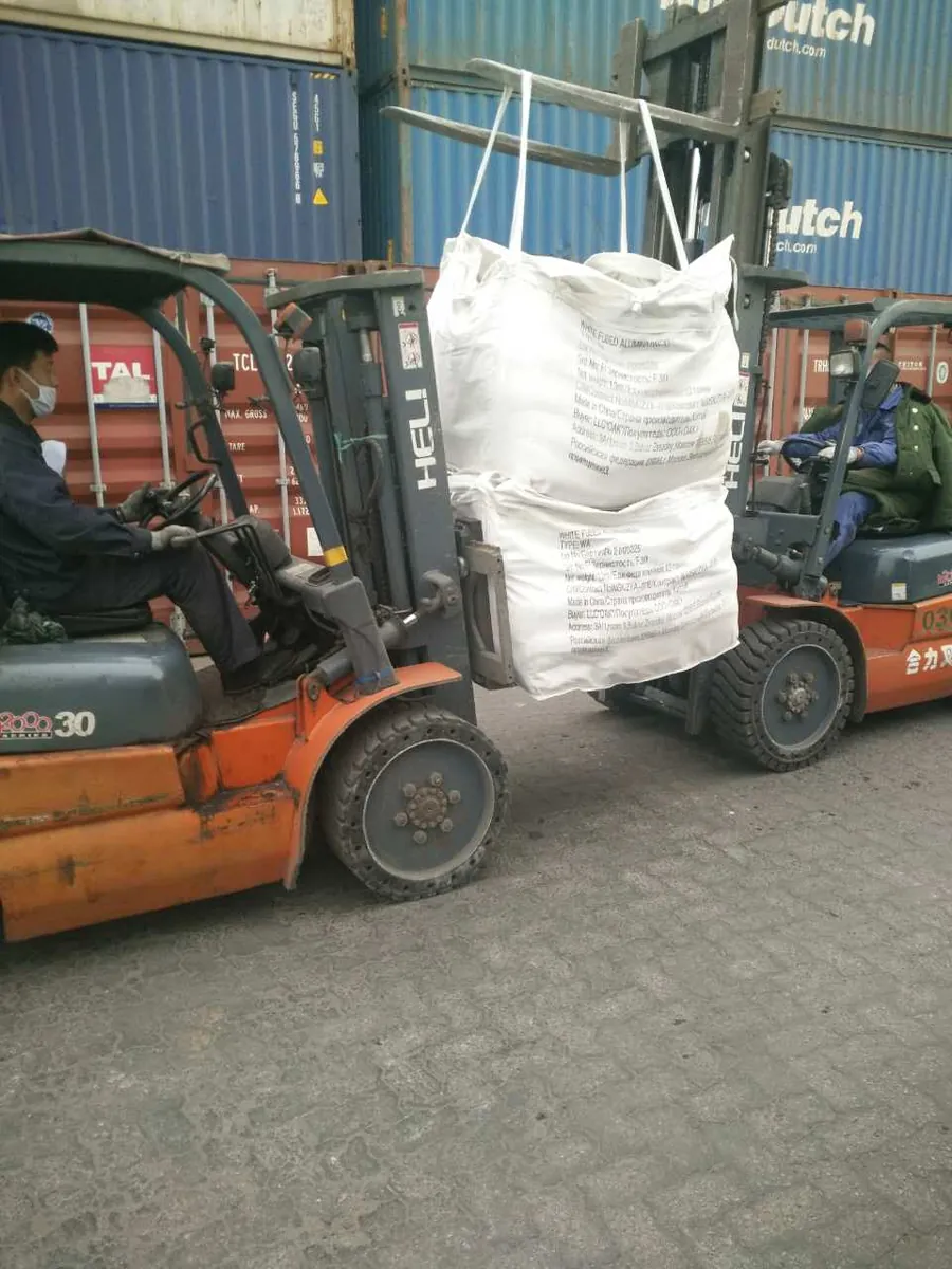 Abrasive material loaded for despatch